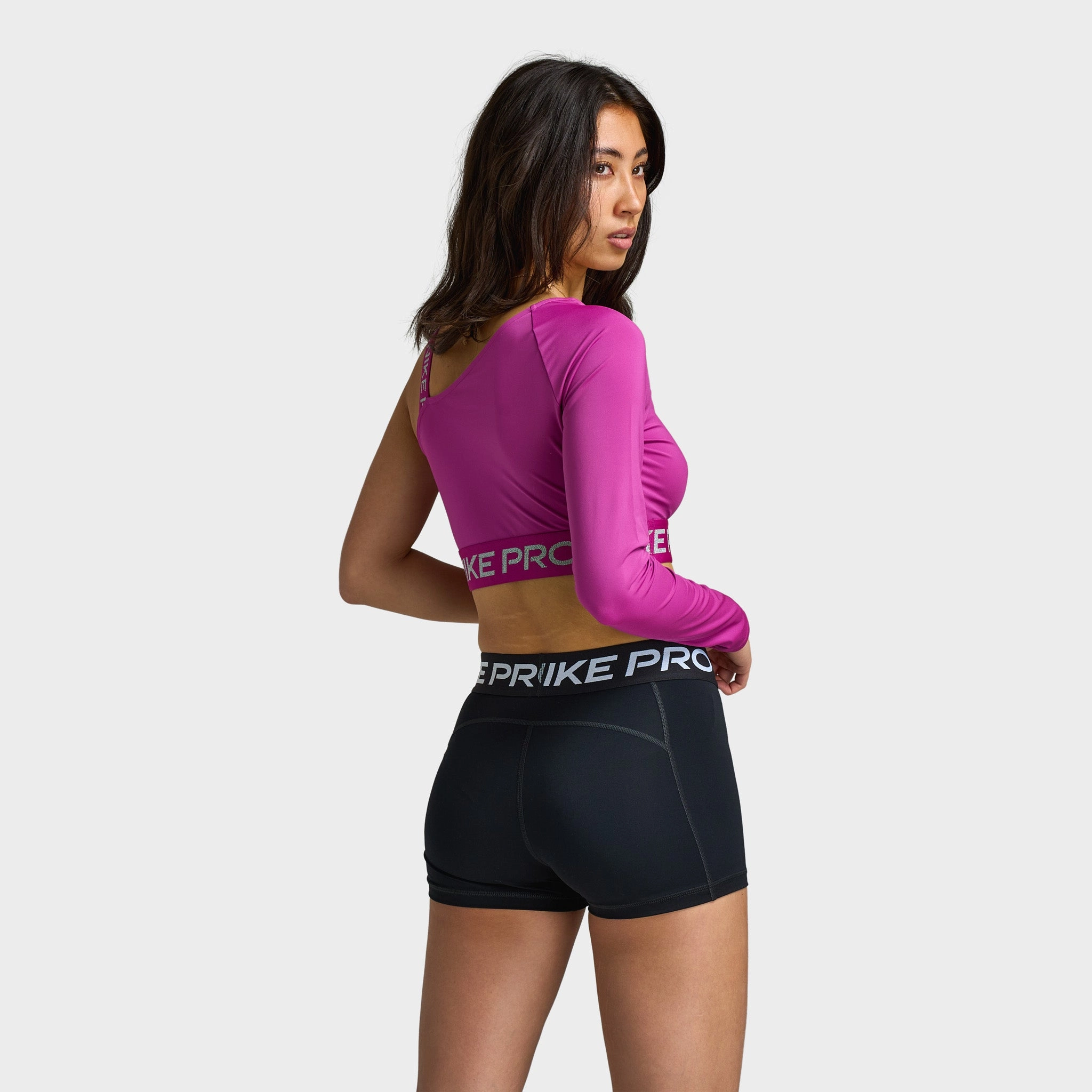 Nike Pro Shine Women's Dri-FIT Asymmetrical Cropped Top / Pink